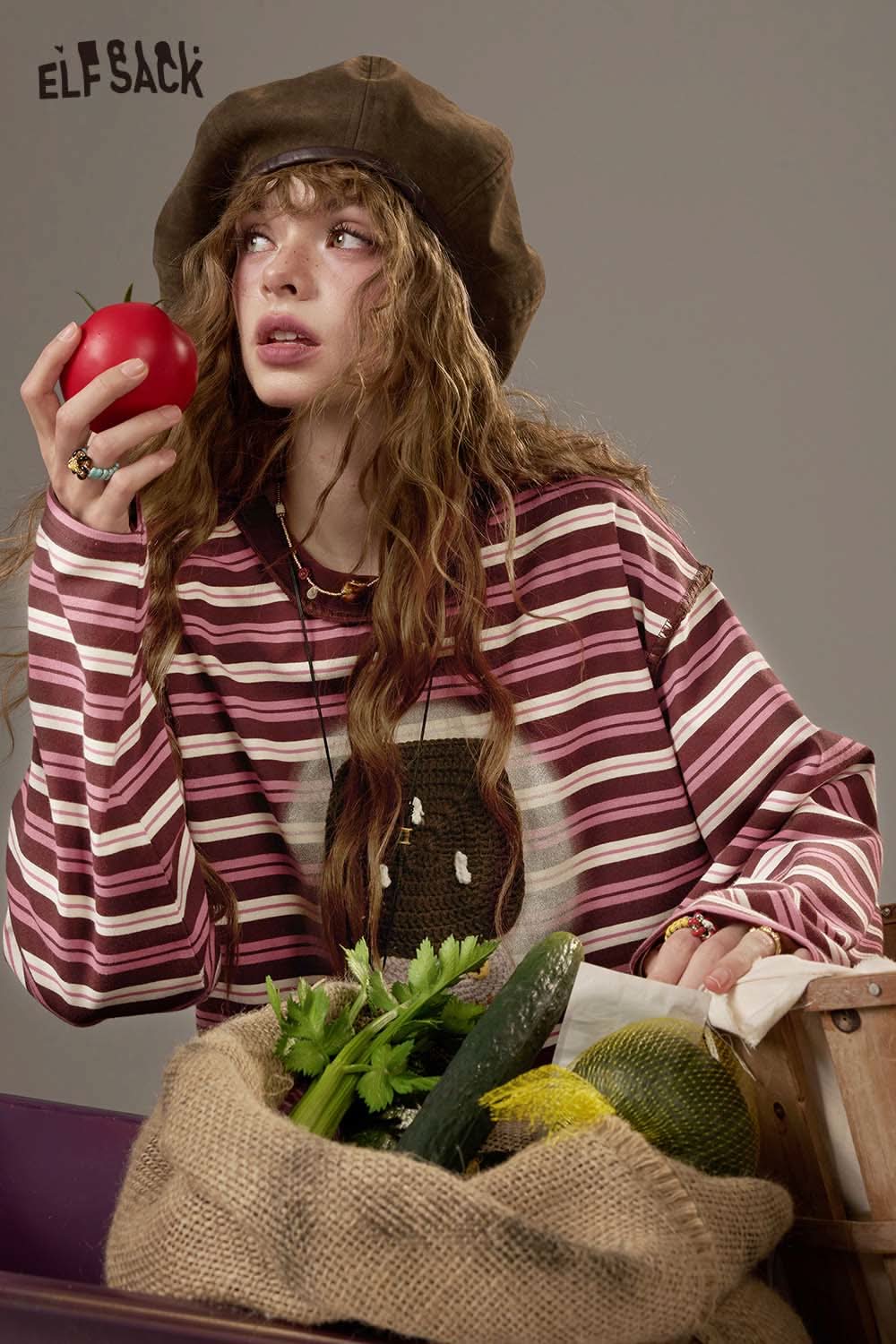 ELFSACK women's soft yarn sweatshirt with striped design, featured with a model holding a tomato