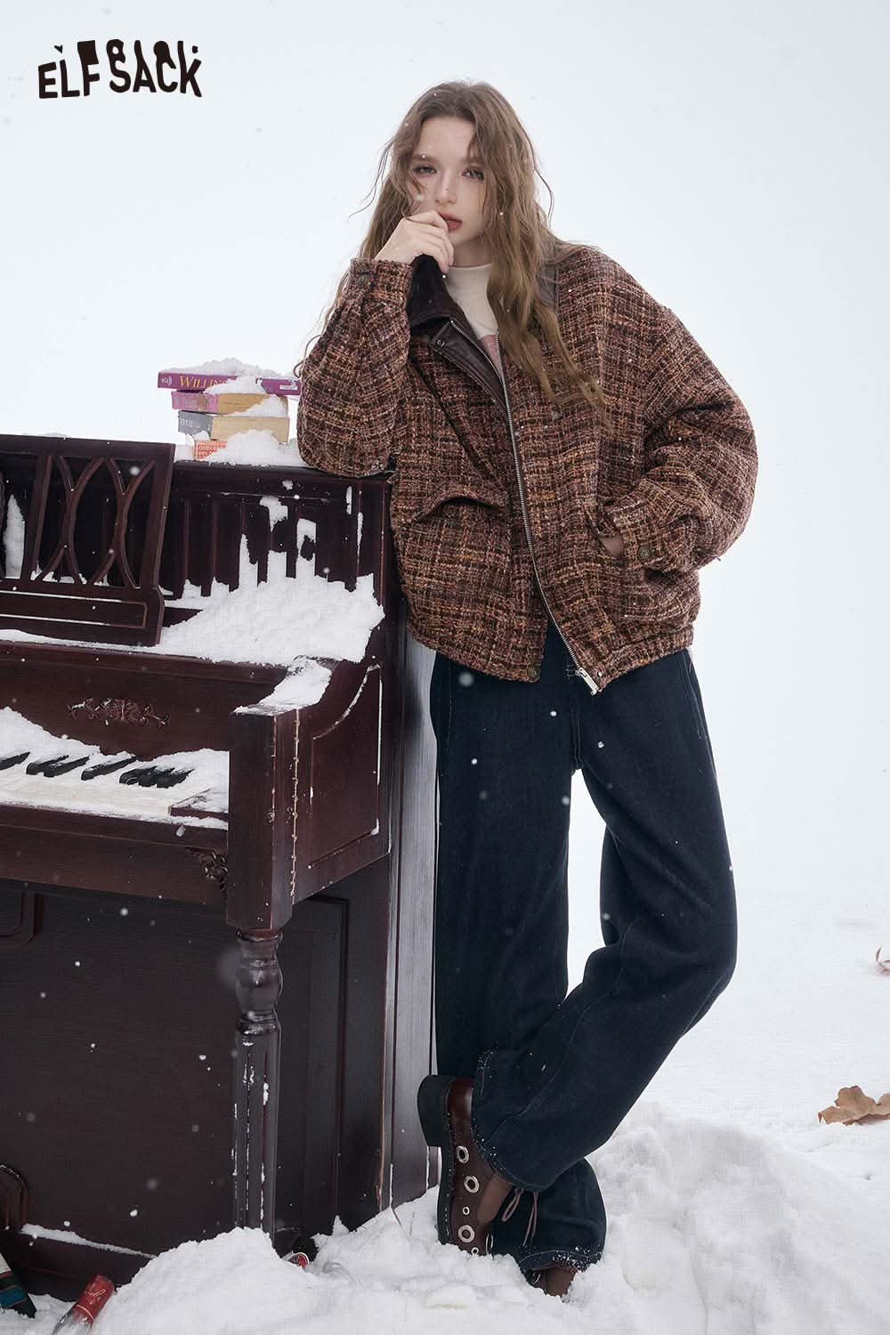 ELFSACK women's straight leg jeans styled with a cozy jacket in a snowy setting