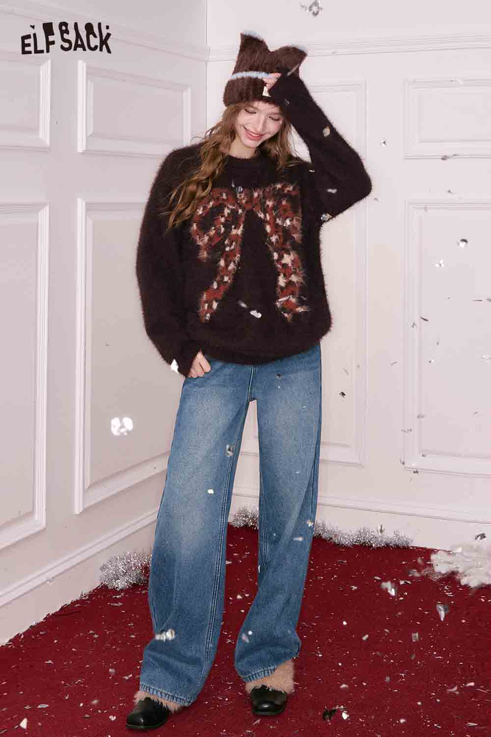 ELFSACK women's straight loose floor length jeans paired with a cozy sweater in a festive setting