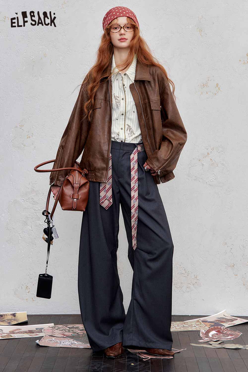 Model wearing an ELFSACK women's stripe poplin shirt with a leather jacket and wide-leg pants