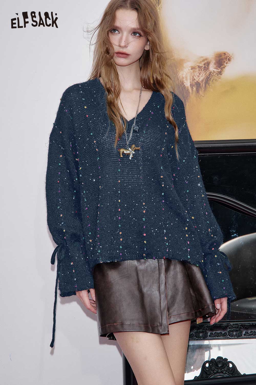 ELFSACK women's v-neck openwork sweater in navy with colorful detailing, styled with a leather skirt