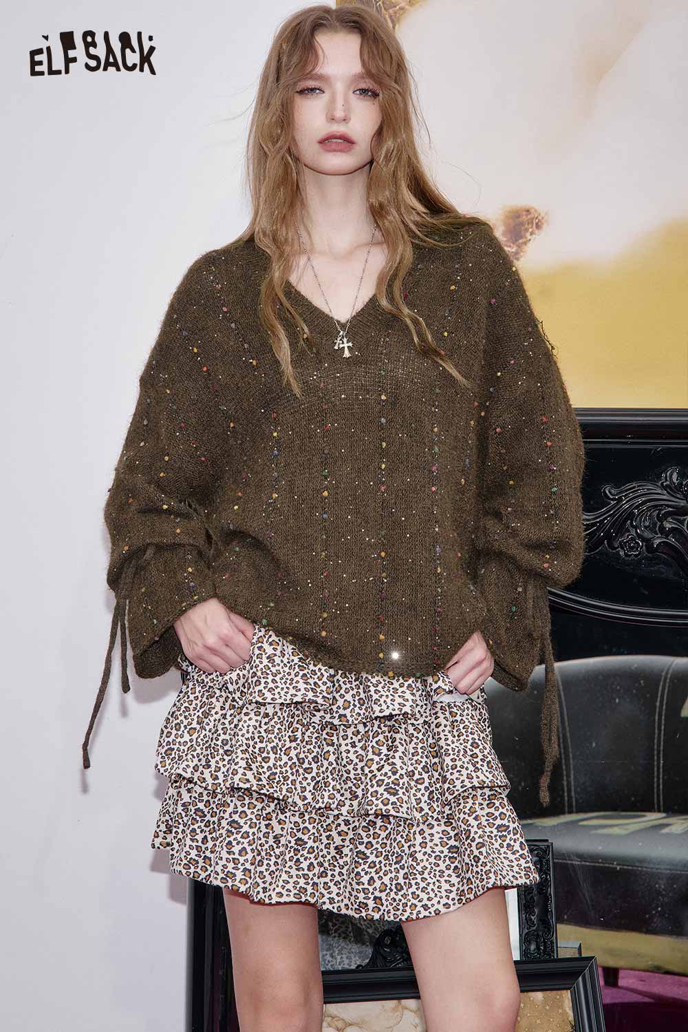 ELFSACK women's v-neck openwork sweater in brown with unique details, styled with a leopard print skirt