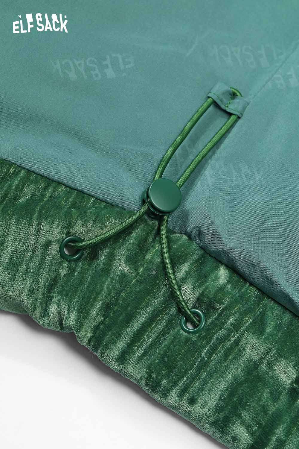 Close-up of ELFSACK women's velvet puffer coat showcasing the green fabric and drawstring details