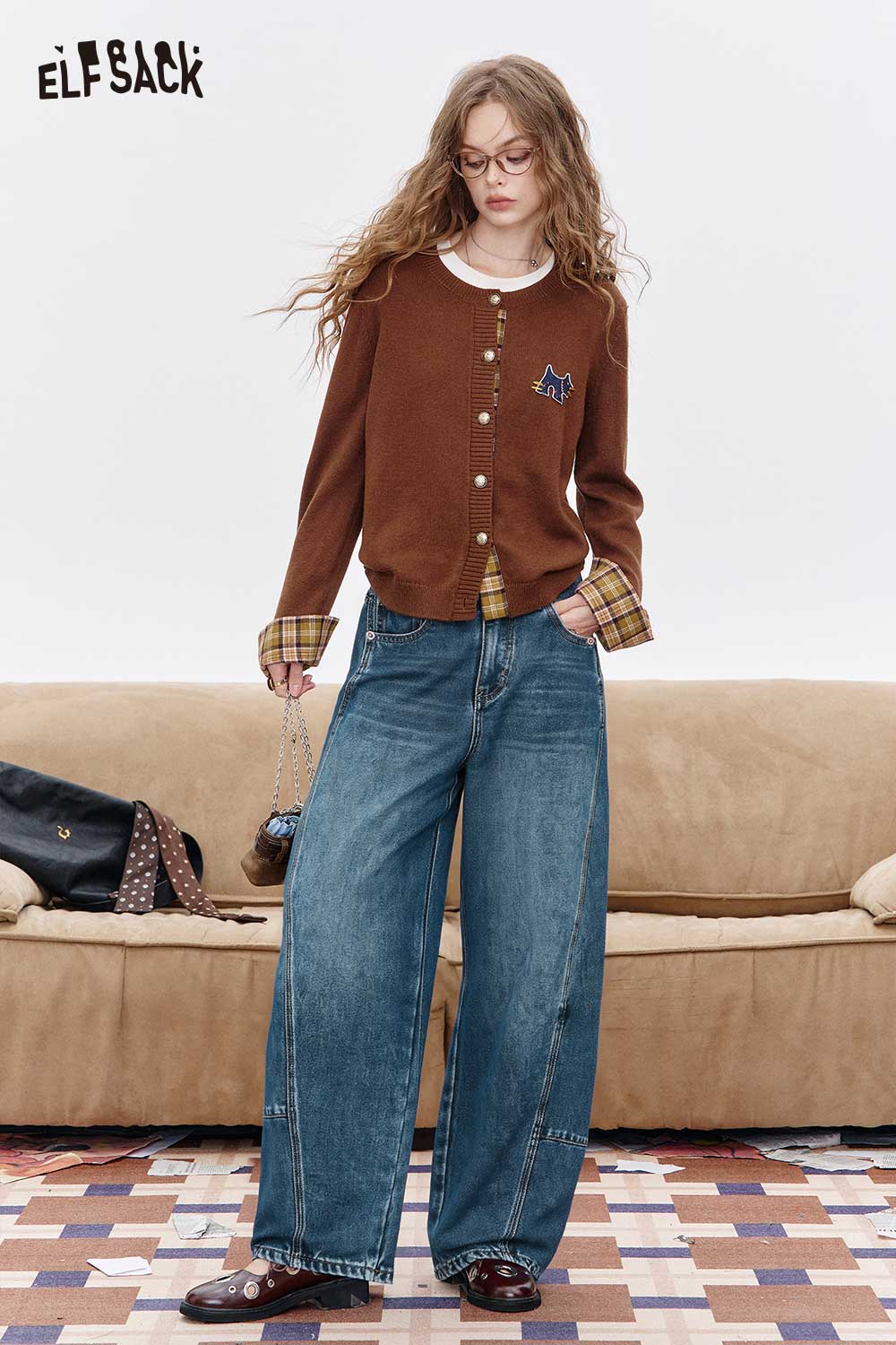ELFSACK women's vintage washed jeans with a relaxed fit, styled with a cozy cardigan and glasses