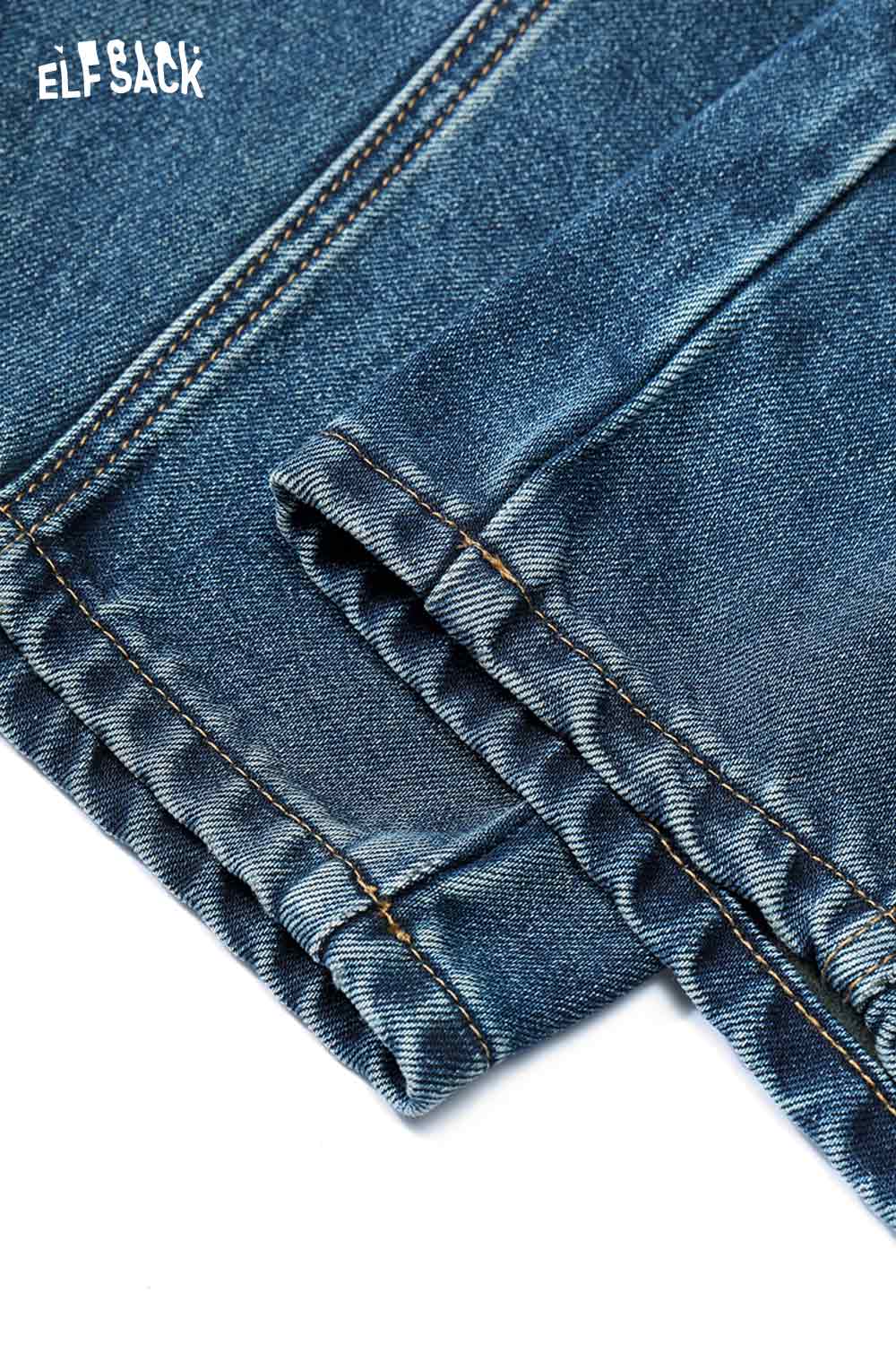 Close-up of ELFSACK women's vintage washed jeans showcasing detailed stitching and fabric texture