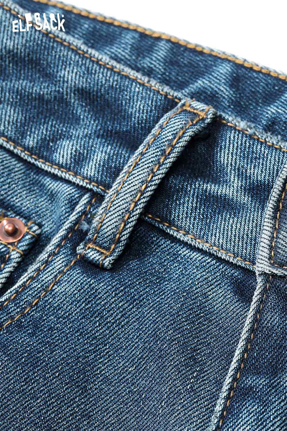 Close-up of ELFSACK women's vintage washed jeans featuring a classic denim texture and detailed stitching