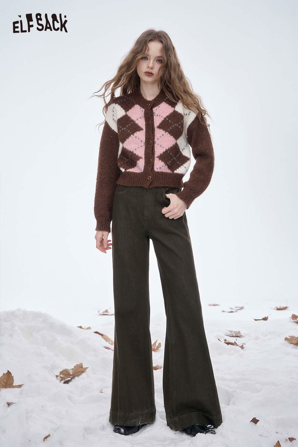 ELFSACK women's wide leg floor length jeans paired with a stylish patterned cardigan on a winter background