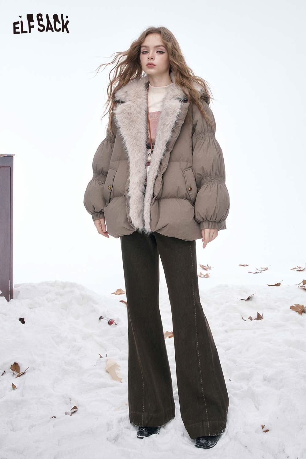 ELFSACK women's wide leg floor length jeans paired with a stylish fur-lined jacket in a snowy setting