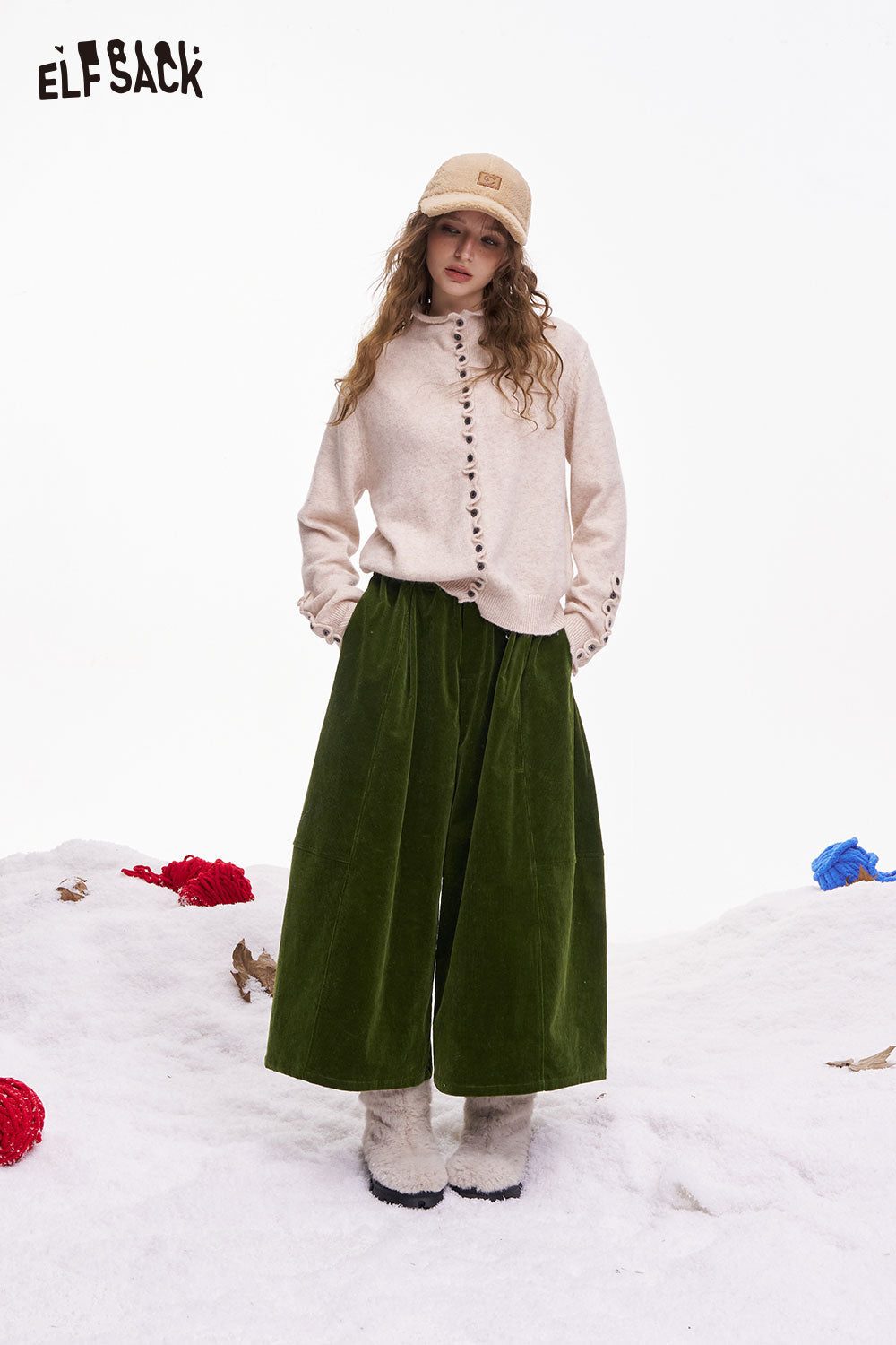 ELFSACK women's wide leg pants in green velvet paired with a button-up sweater for a cozy winter look
