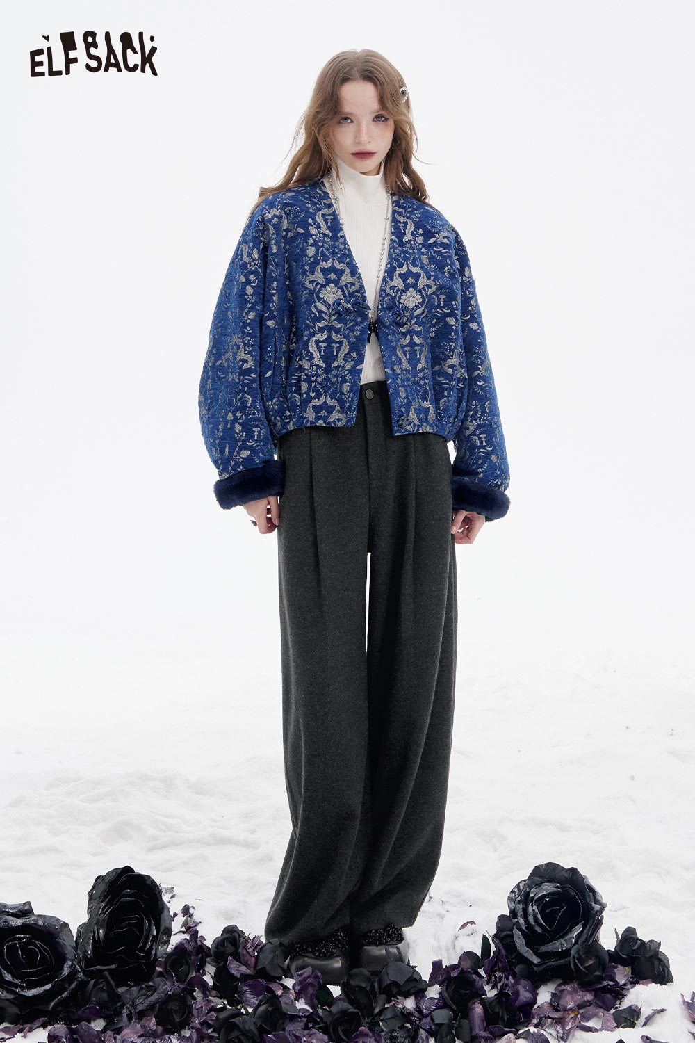 ELFSACK women's wide leg pleated pants styled with a blue patterned jacket on a snowy backdrop