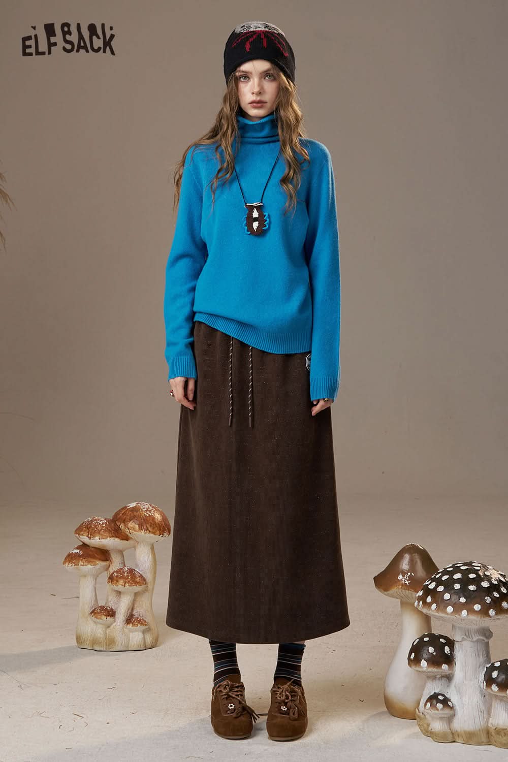 ELFSACK women's wool turtleneck sweater in blue paired with a brown skirt for a stylish look