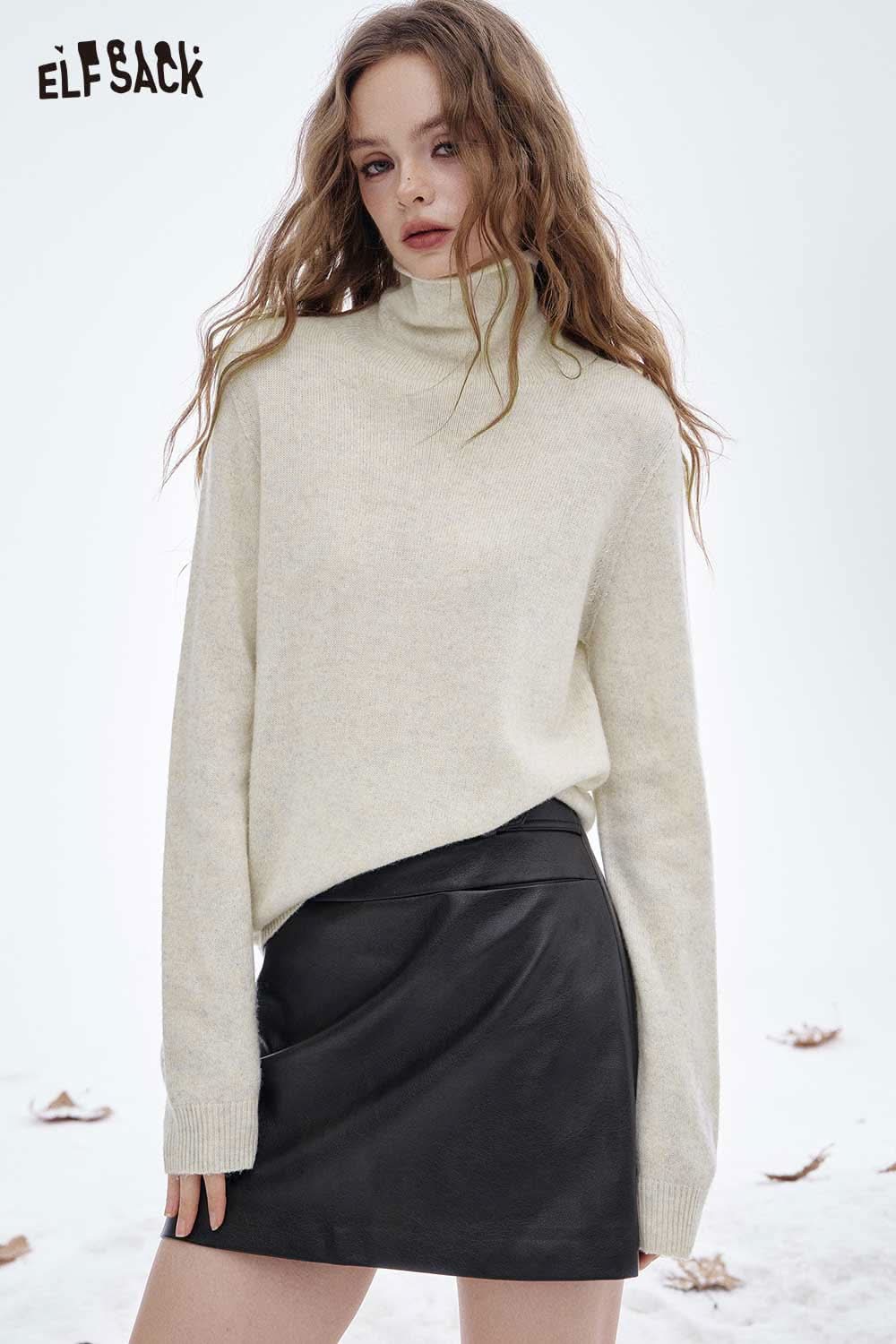 ELFSACK women's wool turtleneck sweater in cream color styled with a leather mini skirt