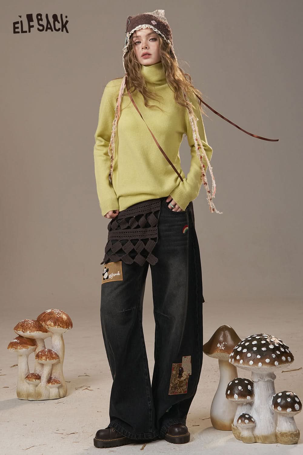 ELFSACK women's wool turtleneck sweater in yellow paired with stylish black wide-leg pants
