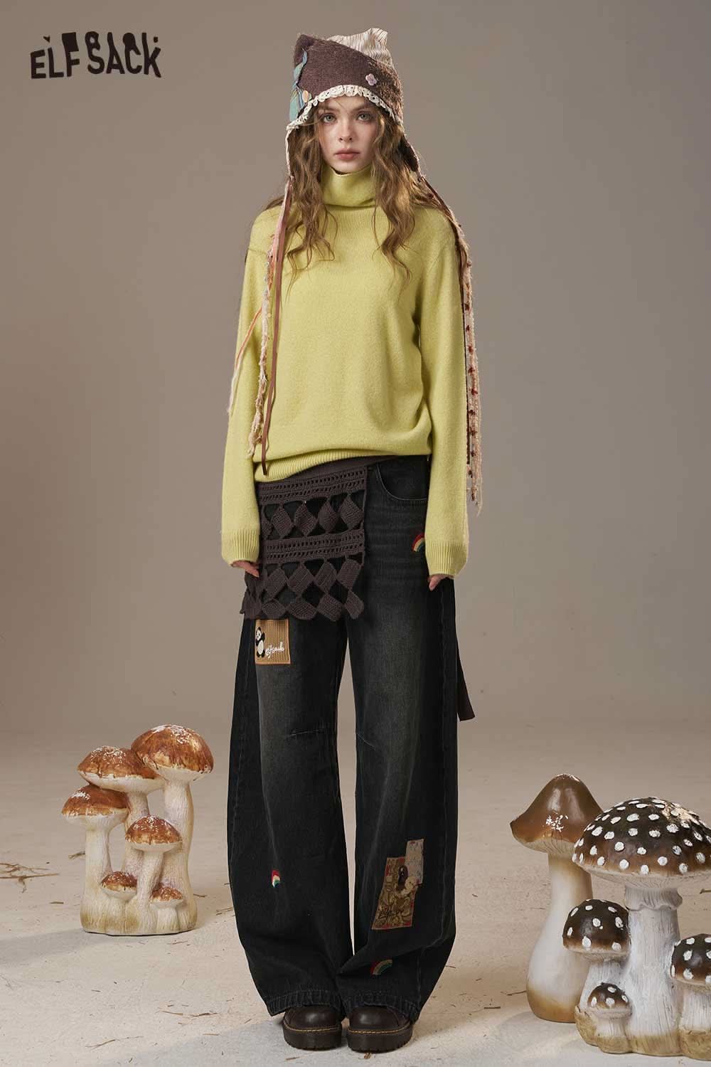 ELFSACK women's wool turtleneck sweater in yellow paired with oversized black pants and a quirky beanie