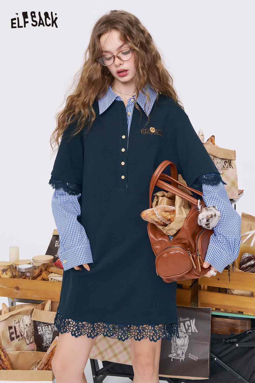 ELFSACK college style knit dress navy polo collar with gingham shirt sleeves and lace hem model holding leather bag