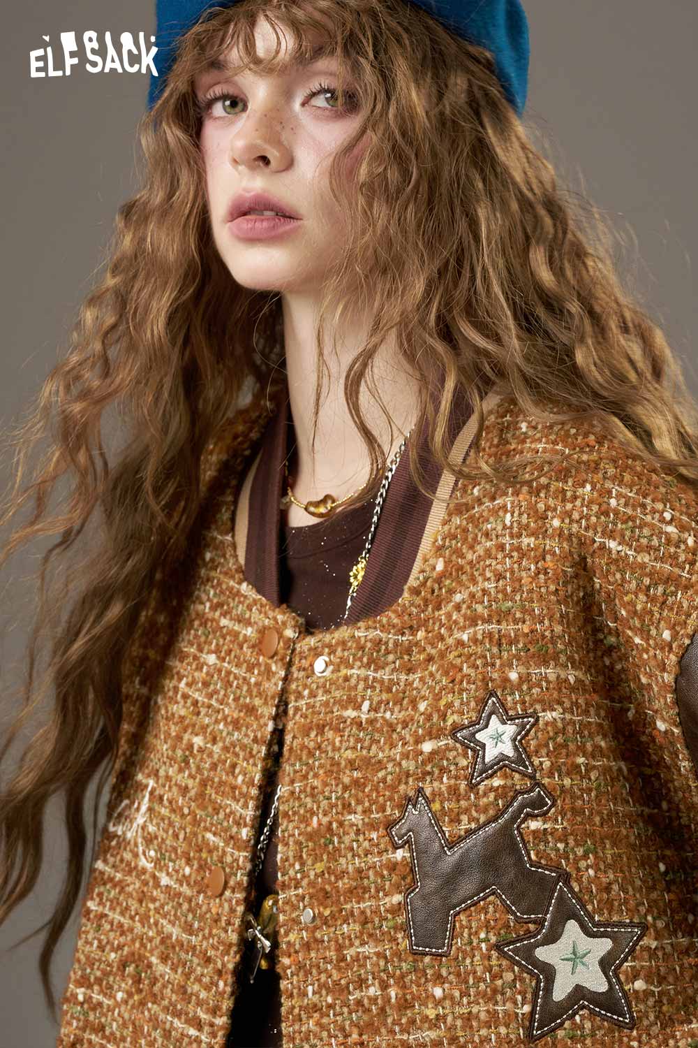 Fashionable ELFSACK wool leather applique jacket featuring unique star designs and warm tones
