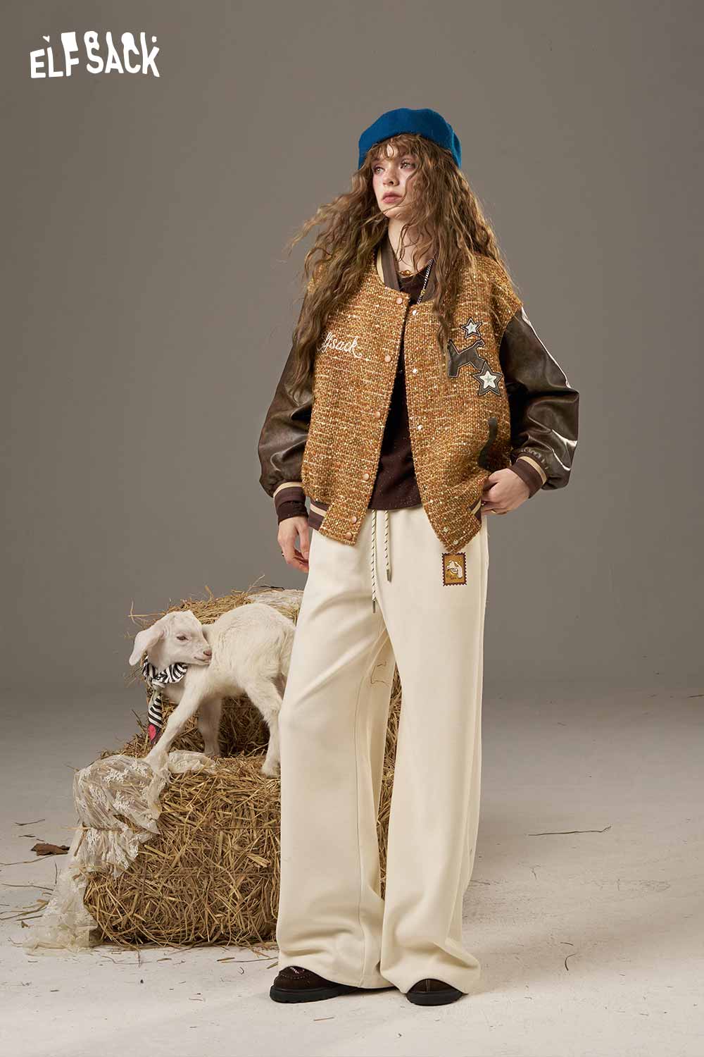 ELFSACK wool leather applique jacket with unique design, paired with relaxed white trousers and stylish beret