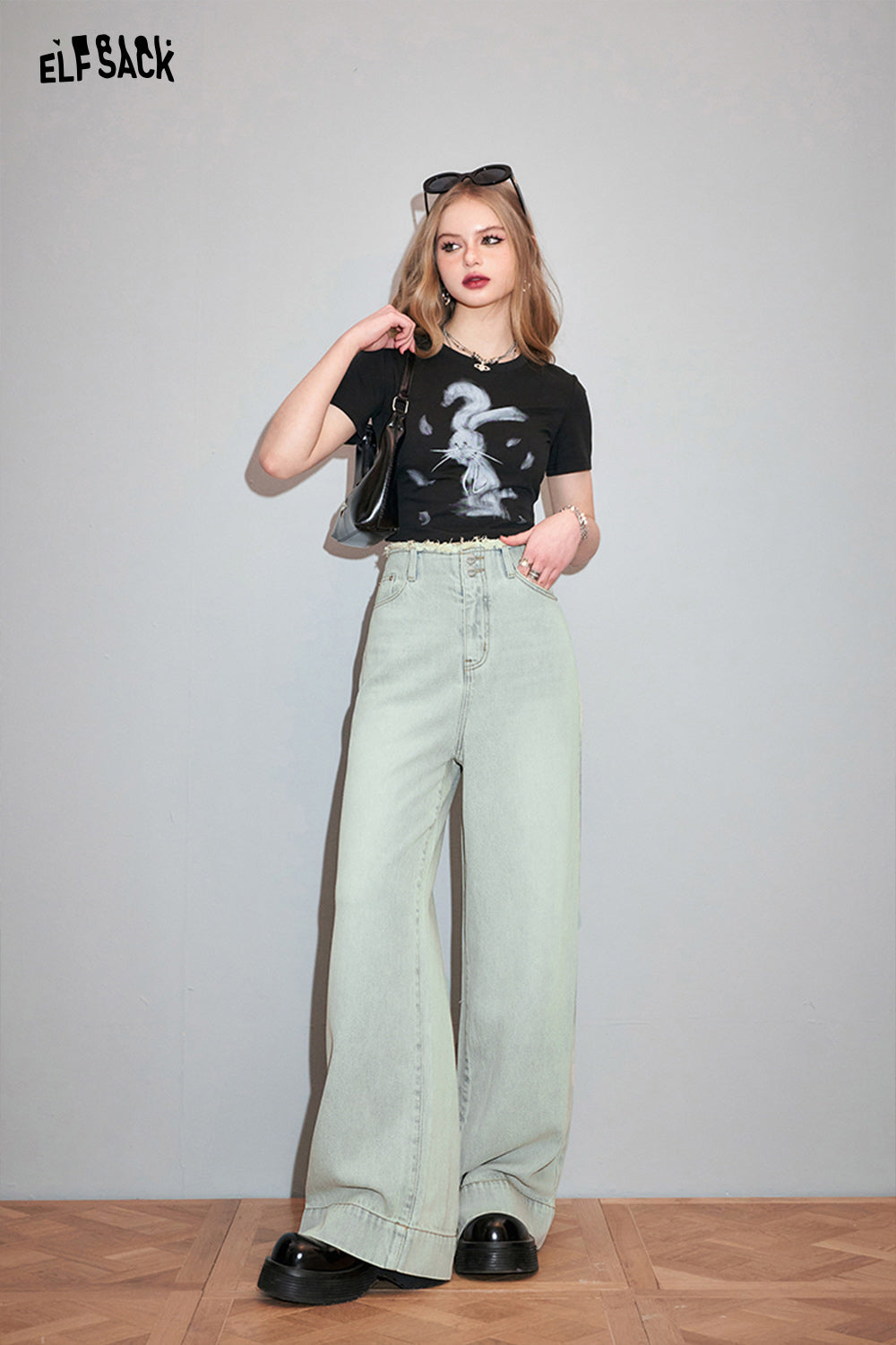 ELFSACK black T-shirt with Y2K Rabbit Print worn with high waist wide leg pants and black shoes