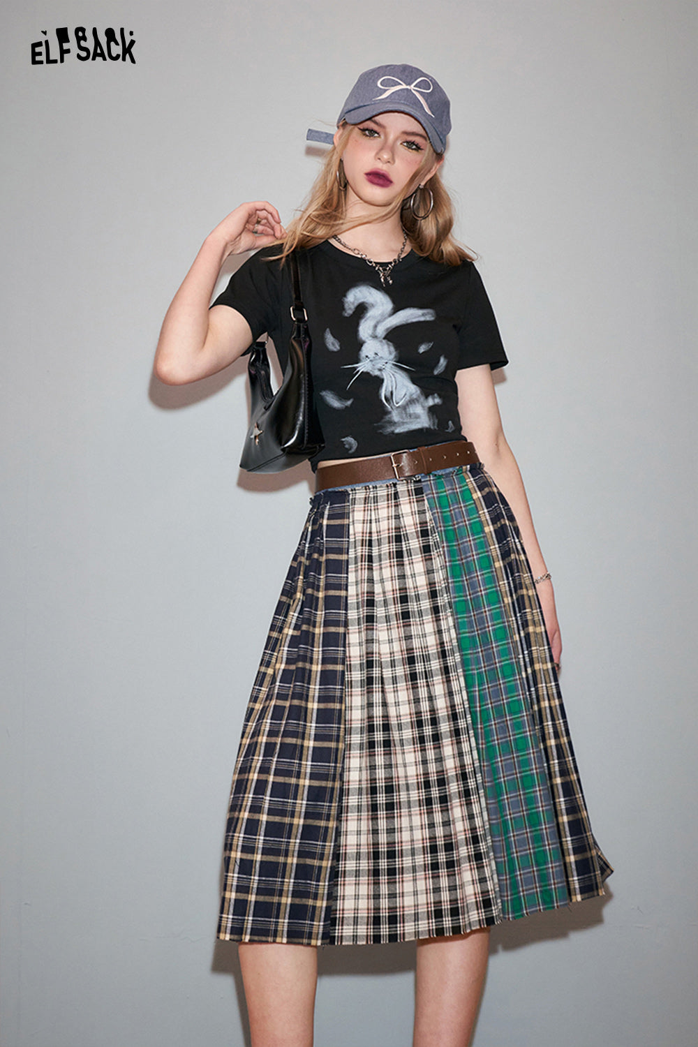 ELFSACK Y2K Rabbit Print black t-shirt styled with a plaid skirt and casual accessories