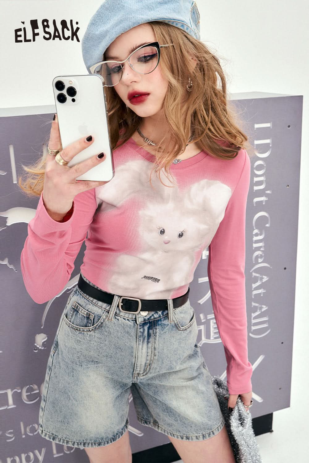 ELFSACK pink long sleeve T-shirt with Y2K Rabbit Print worn with denim shorts and blue beret