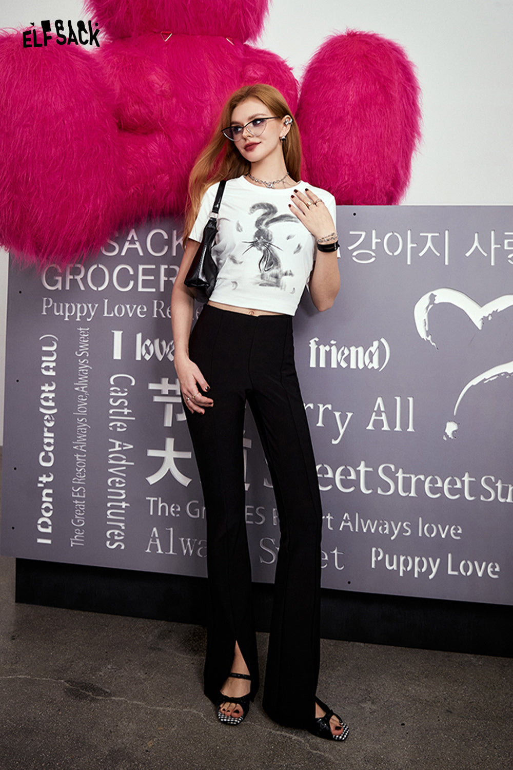 ELFSACK white crop t-shirt with Y2K Rabbit Print worn with black wide-leg pants and black sandals