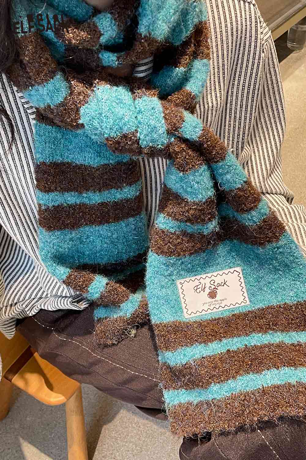 Y2K stripe neck warmer in blue and brown, made from soft fuzzy material for a cozy style