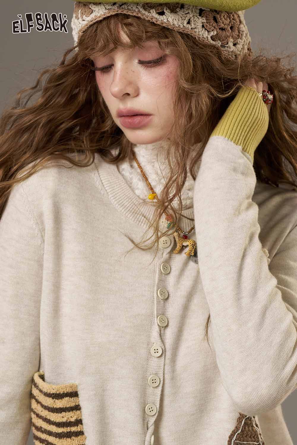ELFSACK women's zebra print knit sweater for women with unique button detail and soft fabric