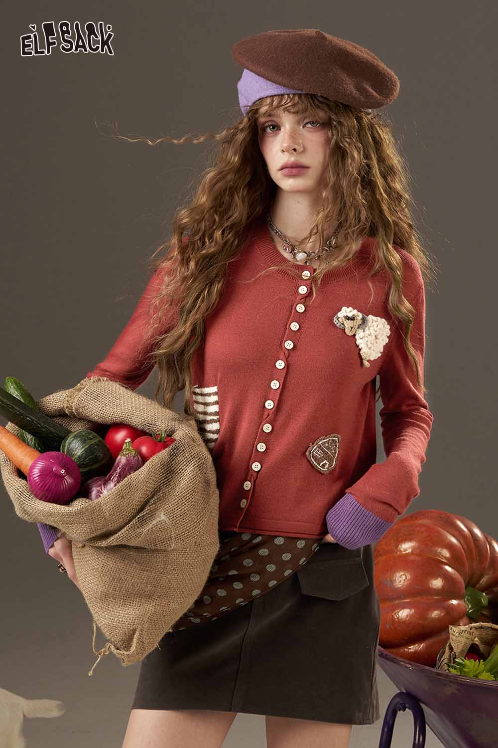 ELFSACK zebra print knit sweater for women styled with a skirt and accessories in a vibrant photoshoot