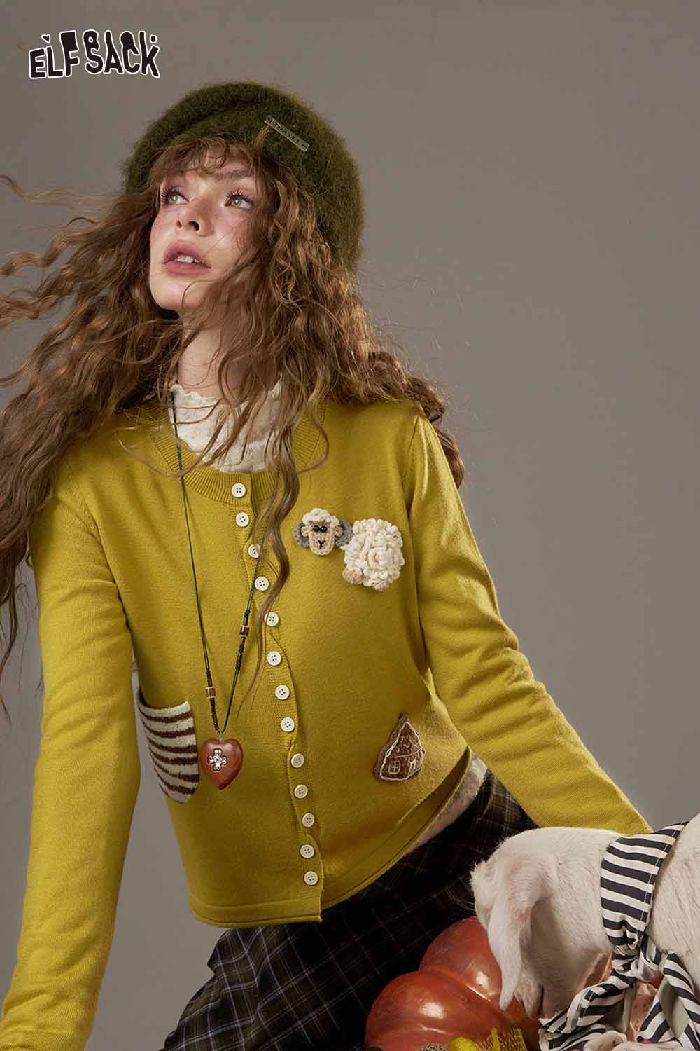 ELFSACK stylish zebra print knit sweater for women paired with chic accessories and a playful background