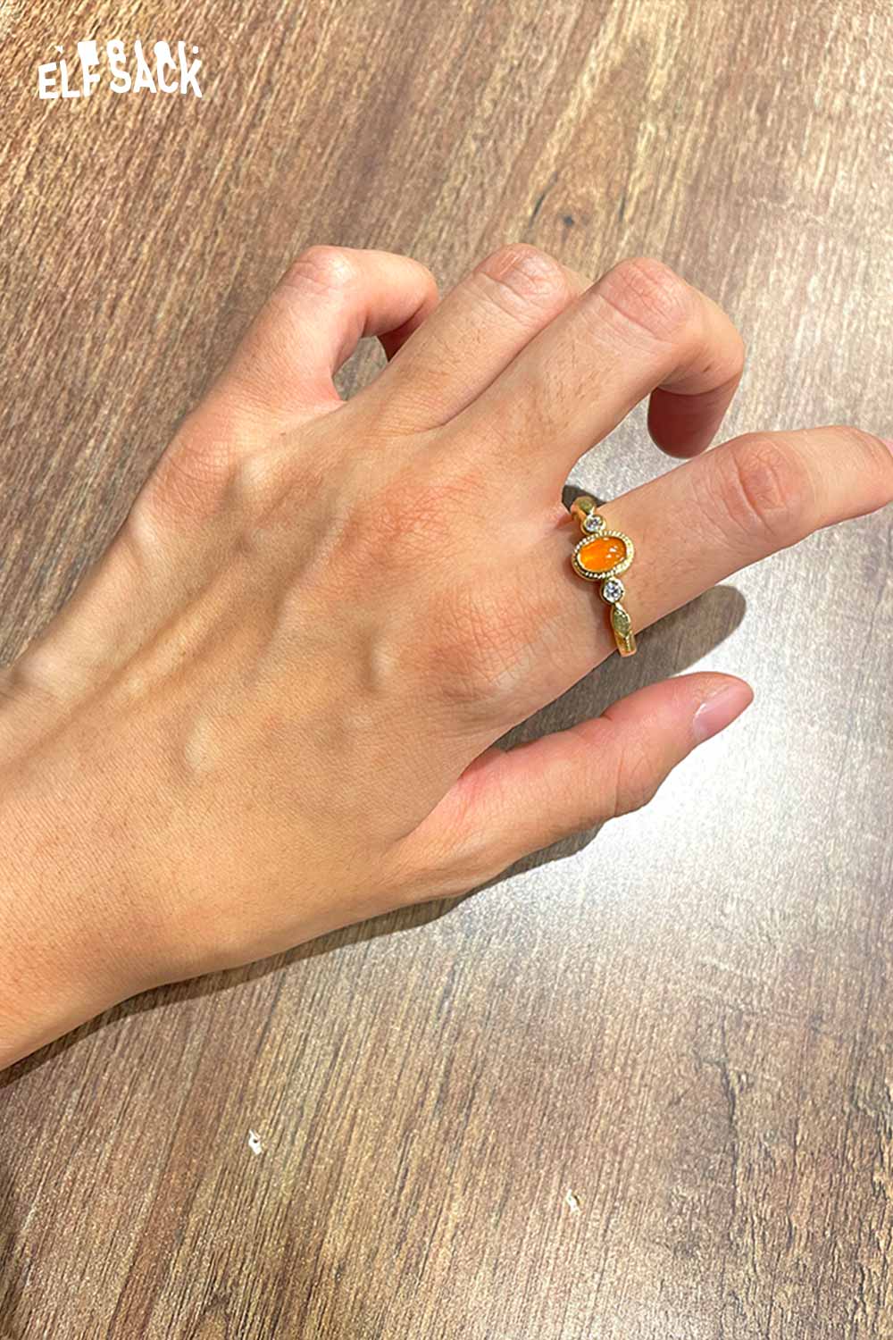 ELFSACK zirconia gemstone copper ring displayed on a hand with a stylish design and elegant finish