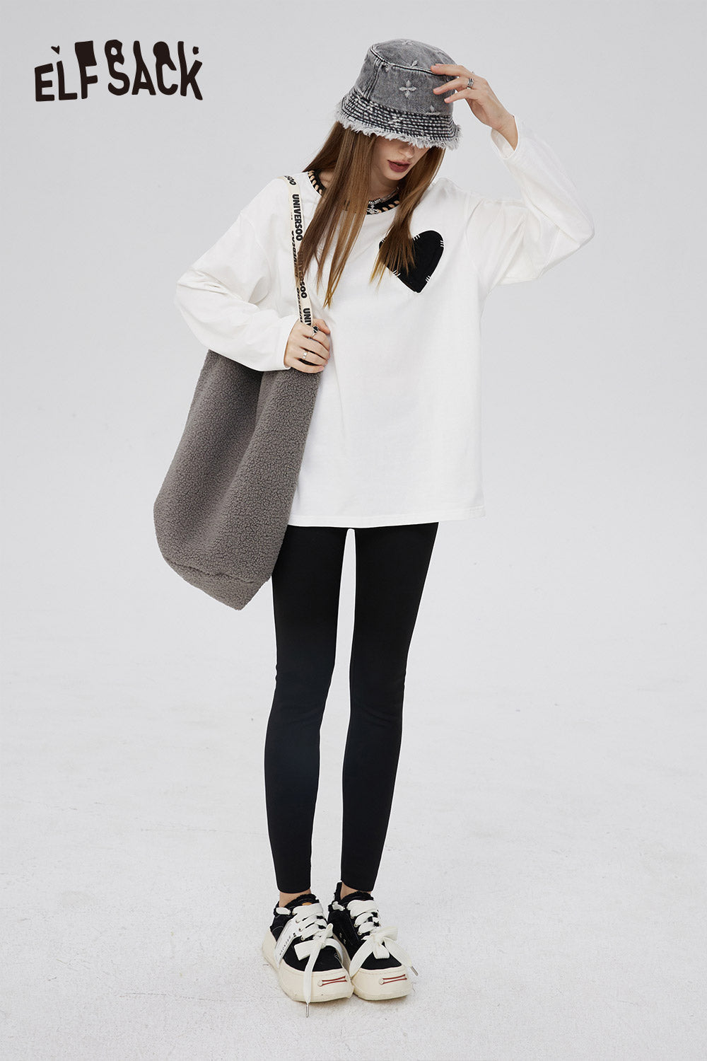 ELFSACK Cotton Heart Embroidered T-shirt white long sleeve with black heart design styled with bucket hat and tote bag