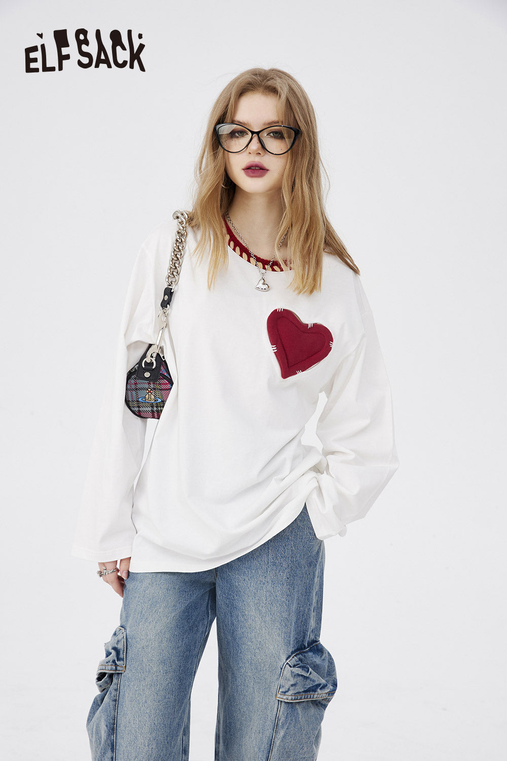 ELFSACK Cotton Heart Embroidered T-shirt in white with red heart patch worn with denim jeans