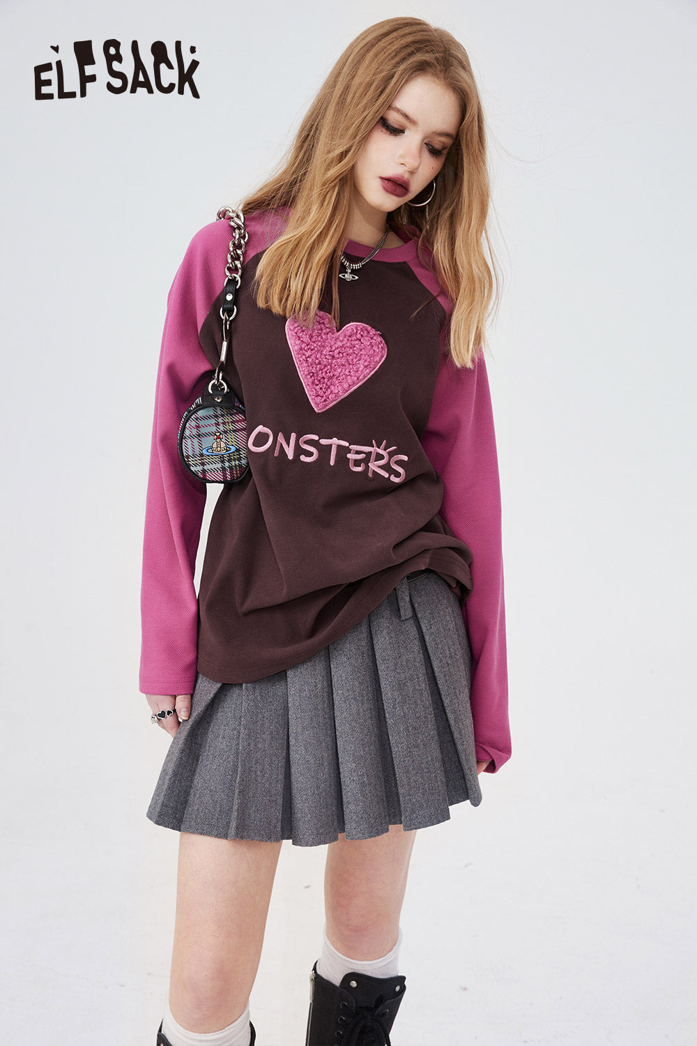 ELFSACK Long Sleeve casual shirt with pink sleeves and heart graphic paired with gray pleated skirt